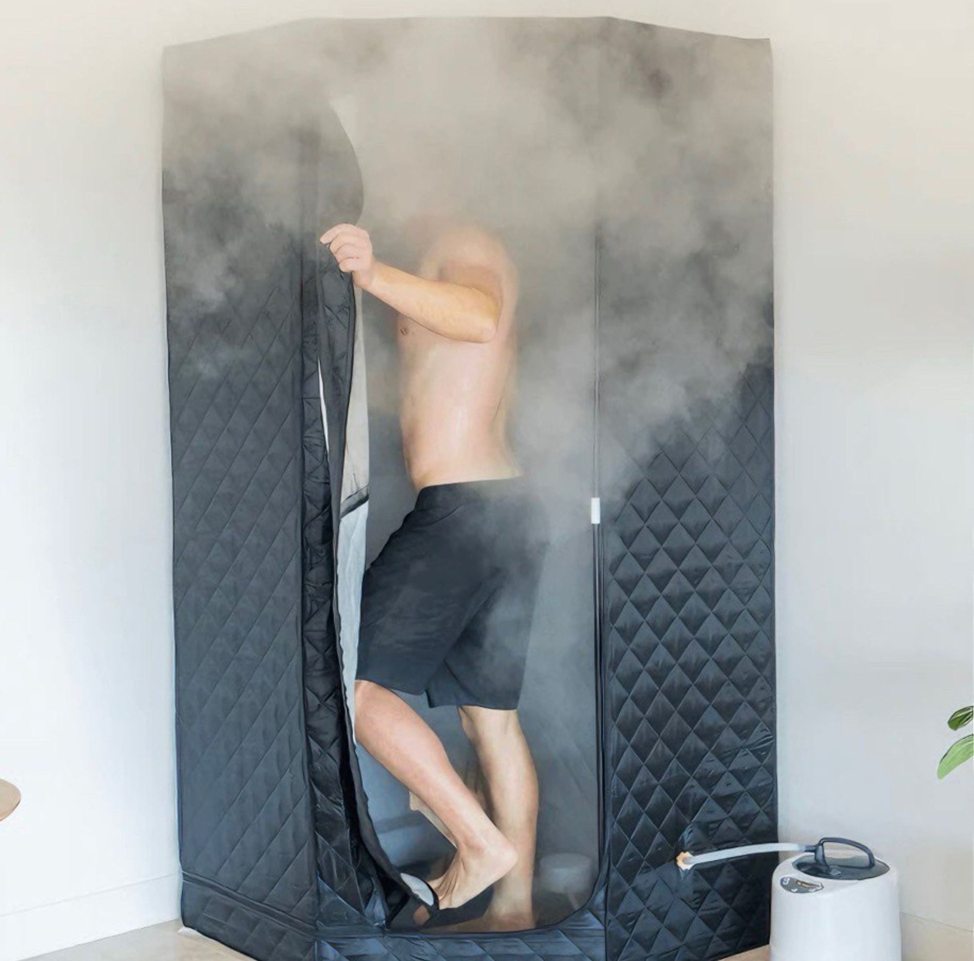 Side view of AuraPro portable steam sauna, showcasing its compact and efficient design.

